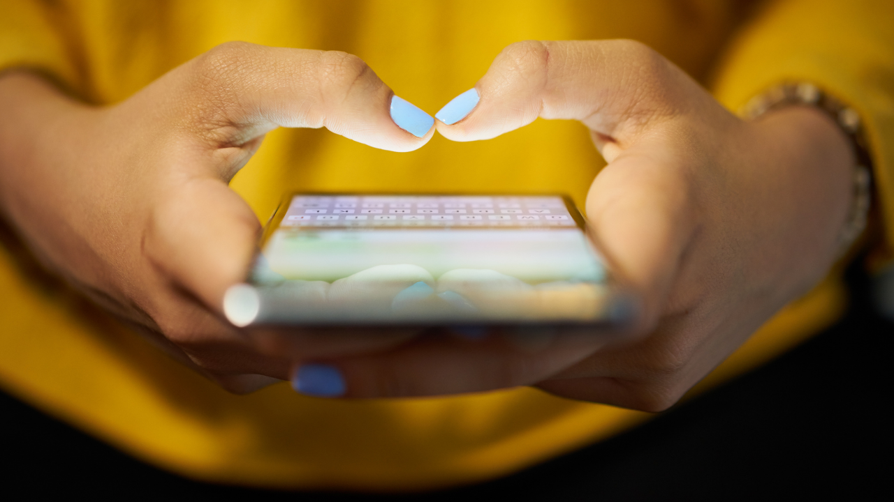 Woman with cell phone in hand