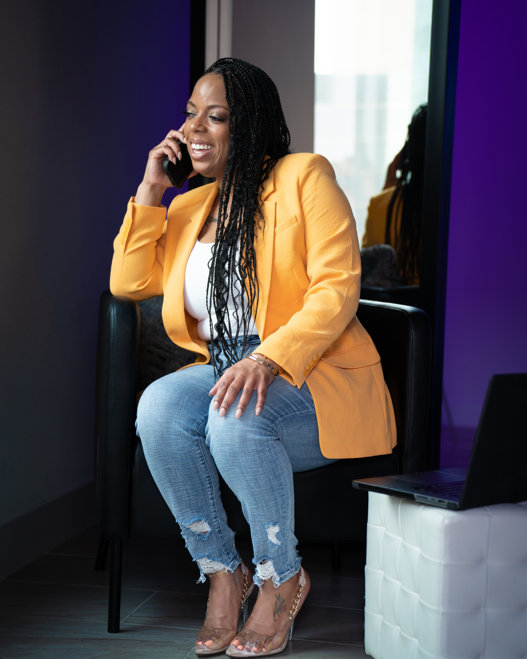 African American Business woman solopreneur talking on phone