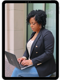 African American Business woman solopreneur typing on laptop on tablet mockup