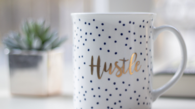 How to Balance Your 9-5 and Side Hustle Like a Pro, coffee mug on counter in front of plant