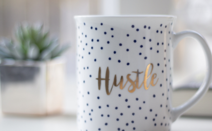 How to Balance Your 9-5 and Side Hustle Like a Pro, coffee mug on counter in front of plant