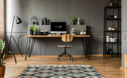 Patterned carpet and plants in grey home office interior, Effective Goal Tracking Strategies for Solopreneurs